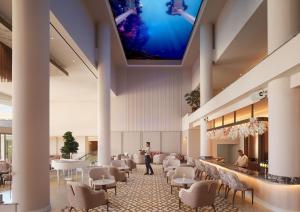 a rendering of the lobby of a hotel at Olympic Lagoon Resort Paphos in Paphos