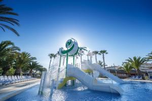 a water slide in a pool at a resort at Camping Estival Vendrell Platja in Comarruga