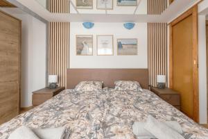a bedroom with a large bed with two night stands at Terminal Garden Apartman in Budapest