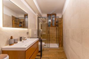 a bathroom with a sink and a shower at Ina's Lake Garden, Como Lake in Lenno
