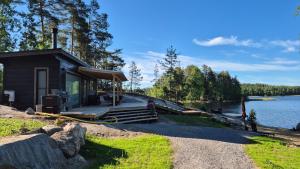 a small cabin on the shore of a lake at Sauna by Lake Saimaa in Savonlinna