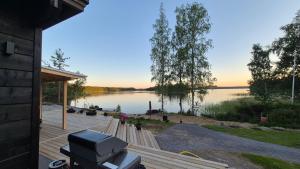 a view of a lake from the porch of a house at Sauna by Lake Saimaa in Savonlinna +18 photos