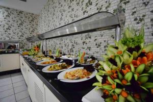 a buffet line with plates of food in a restaurant at Blue Garden Family Side in Side