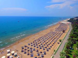 an overhead view of a beach with umbrellas and the ocean at Blue Garden Family Side in Side