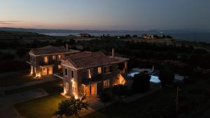 an aerial view of a house with lights on at Anasa Villas in Mythimna