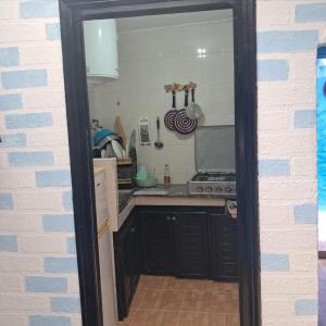a kitchen with a sink and a stove at Bleu Chefchaouen in Chefchaouen