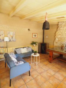 a living room with a couch and a table at La Senda Del Duratón in Sebúlcor