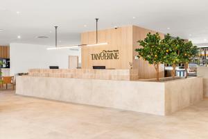 a restaurant lobby with a counter with a waiting area at Tangerine by Honne Hotels - Adults Only in Magaluf +41 photos