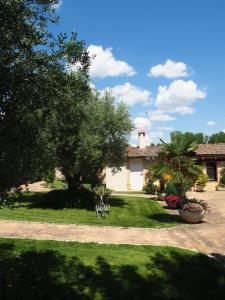 a house with a bike parked in a yard at La Senda Del Duratón in Sebúlcor