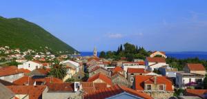a view of a town with houses and a hill at The Villa Vatikan in Trpanj