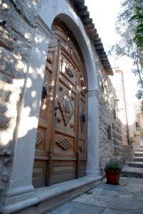 a large wooden door in a stone building at The Villa Vatikan in Trpanj