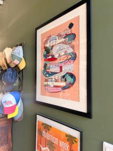 a picture of a poster of a hotel on a wall at VILLA Nîmes tourmagne PISCINE in Nîmes