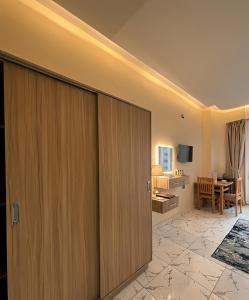 a room with a sliding door and a dining room at Via Cairo hotel in Cairo