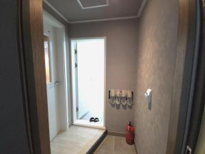 a bathroom with a shower with a window at AREA HoTEL in Yeongju +18 photos
