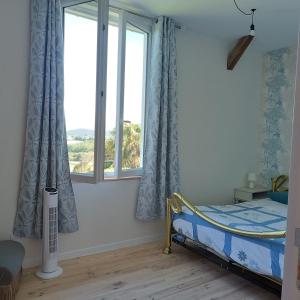 a bedroom with a bed and two windows at Pyrenees Vue Gite - Owl - Vues Fantastique, Petit-Déjeuner, Calme, Piscine, Parking - Brand New in Saint-Gaudens +46 photos