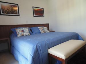 Postel nebo postele na pokoji v ubytování Ceferino Hotel