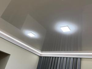 a room with three lights on the ceiling at new stail centr in Bălţi +1 photo
