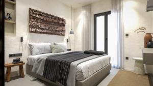 a bedroom with a large bed and a large window at Clementina Hill in Naousa +63 photos
