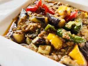a dish of food with vegetables in a box at Saga City Hotel in Saga