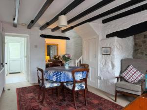 a dining room with a table and chairs at Derlwyn in Newport