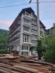 a building under construction with scaffolding at Садиба Маковиця in Yaremche
