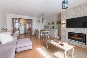 a living room with a couch and a table at Azor Beach Lodge in Ponta Delgada