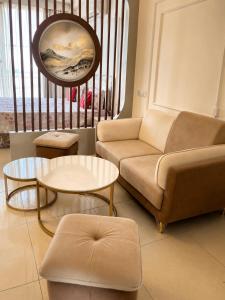 a living room with a couch and a table at Skyline Zirakpur in Zirakpur