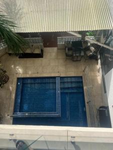 an overhead view of a swimming pool in a building at EL and LOUNGE in Accra