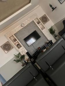 an overhead view of a living room with a clock at EL and LOUNGE in Accra
