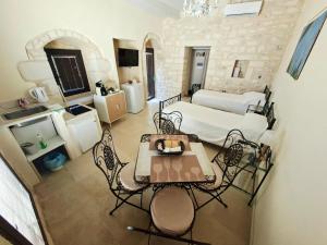 a large living room with a table and chairs at Borgo Hedone in Scicli +75 photos