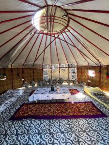 a large tent with a table in the middle at D&N Karakol in Karakol +76 photos