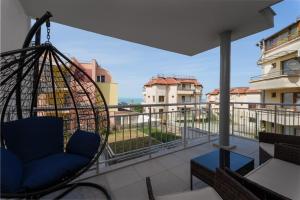 a swing on the balcony of a apartment at Transilvaniya Apartments in Sozopol