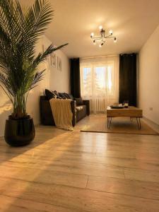 a living room with a couch and a coffee table at Apartament w Centrum Prudnika in Prudnik