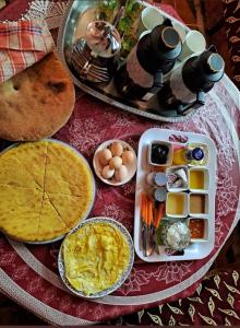 a table with a plate of food on a table at Gîte tazekka in Taza +40 photos