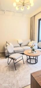 a living room with a couch and a table at Artesano A71 in Nairobi +3 photos
