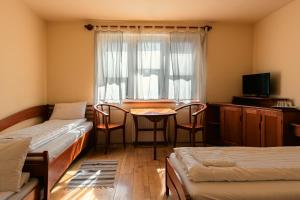 Llit o llits en una habitació de Posticum Guesthouse