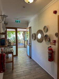 a kitchen with plates on the wall next to a door at Faralya Misafir Evi in Faralya