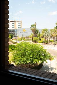 a window with a bush in front of a building at SUNDOS Feria Valencia in Valencia