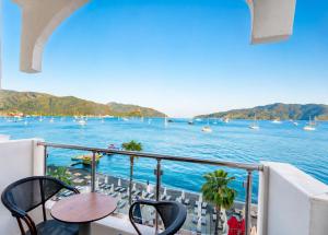 a balcony with a view of the water and boats at La Vita Hotel marmaris in Marmaris