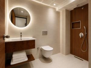 a bathroom with a toilet and a sink and a mirror at La Vita Hotel marmaris in Marmaris +45 photos