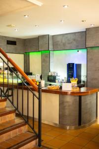 a kitchen with a counter with food on it at SUNDOS Feria Valencia in Valencia