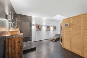 a hallway with wooden cabinets and a bench in a room at Villa Donau - Sauna & Whirlpool in Vienna