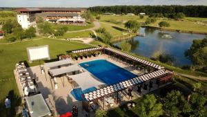 an overhead view of a swimming pool and a river at Casa Vlasia in Snagov