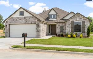 a house with a parking meter in front of it at New Dream Home in Broken Arrow! in Broken Arrow