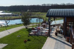 an overhead view of a restaurant with a lake at Casa Vlasia in Snagov +27 photos
