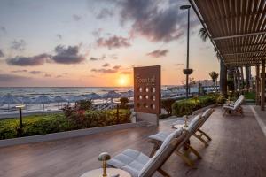 a patio with chairs and a view of the beach at Side Star Beach Hotel - Ultra All Inclusive in Side