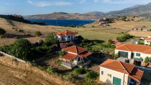 an aerial view of a house on a hill at Iris apartment 1 in Anaxos
