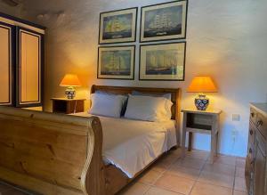 a bedroom with a bed with two tables and two lamps at Gentilini Retreat in Argostoli