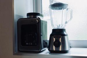 a blender sitting on a counter next to a window at MOTOBU Ocean Private Villa in Motobu
