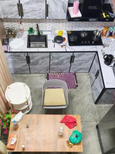 an overhead view of a kitchen with a counter top at Mount Homestay in Nedukandam +11 photos